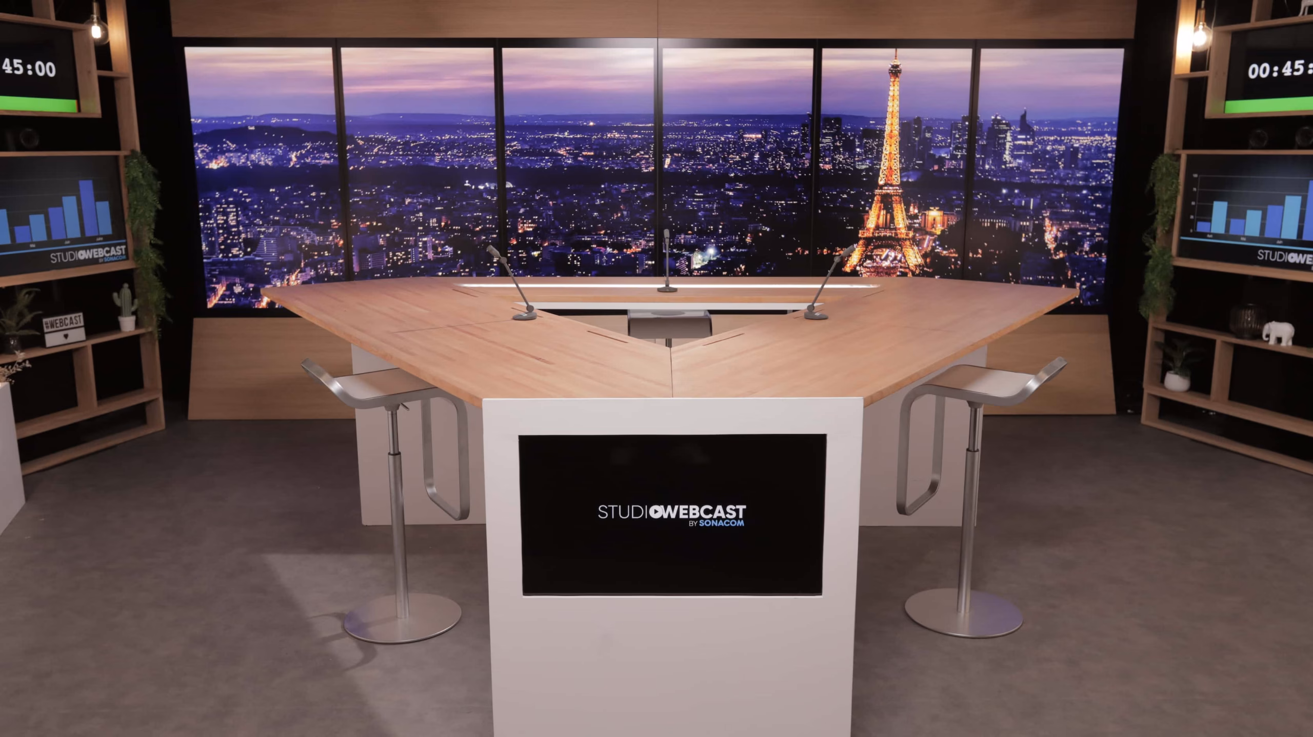 Plateau TV du Studio Webcast avec fond LED Paris de nuit et bureau hexagonal